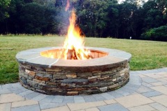 Outdoor patio installation of fire pit in Glenelg