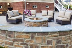 Pation installation with retaining wall and fire pit in Sykesville