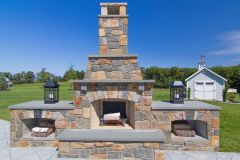 Outdoor patio design in Glenelg with fireplace