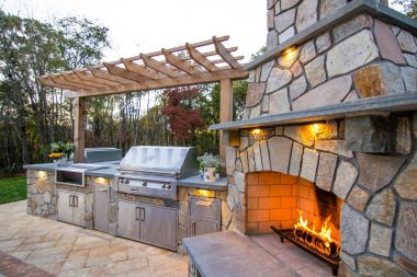 Outdoor patio installation with outdoor kitchen and fireplace